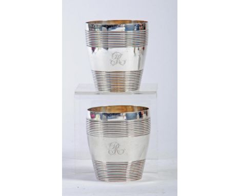 A  PAIR OF GEORGE III SILVER TUMBLERS, maker Samuel Hennell, London 1805, of barrel form with reeded banding, engraved "R", 3