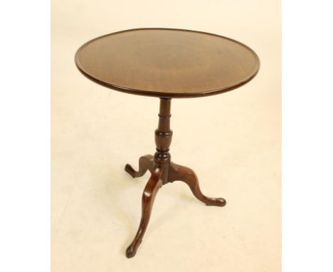 A GEORGIAN MAHOGANY TRIPOD TABLE, late 18th century, the dished circular tip up top on turned vase shaped stem, the base with