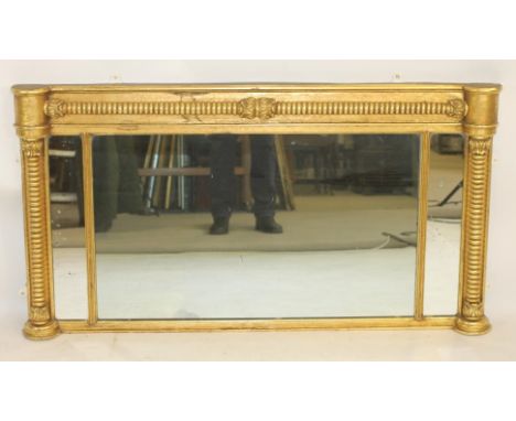 A REGENCY GILT WOOD TRIPLE PLATE OVERMANTEL MIRROR, mildly moulded cornice, frieze applied with a leaf clasped and reel turne