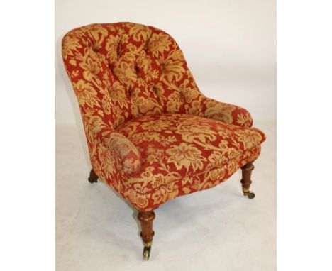 A VICTORIAN LIGHT OAK FRAMED NURSING CHAIR, button upholstered in a rust and cream foliate weave, arched back extending to lo