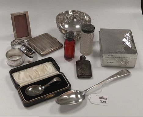 A collection of silverware including flatware, bowl, cigarette case, cigarette box, napkin rings silver topped glass bottles 