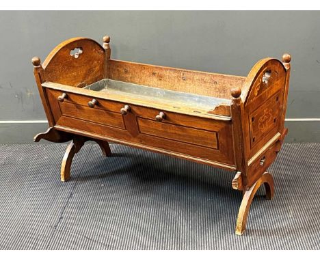 A 19th century Continental walnut and inlaid cradle, converted to a planter with zinc liner 67 x 100 x 54cm