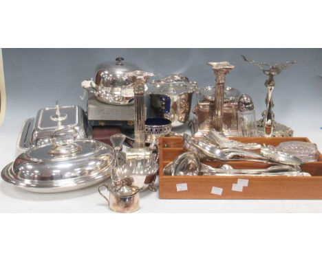 A collection of silver plated ware to include entree dishes, muffin dish, a pair of candlesticks, flatware etc.