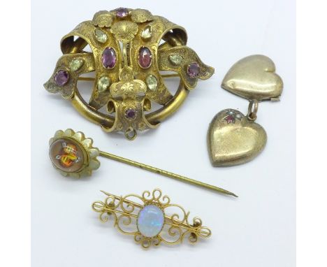 A Victorian pinchbeck brooch set with amethyst and paste stones, an opal brooch, fox head pin and locket, locket a/f