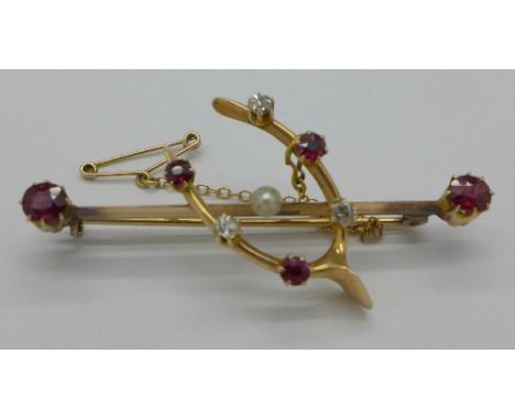 A 15ct gold, diamond, ruby and pearl wishbone brooch, 5.4g