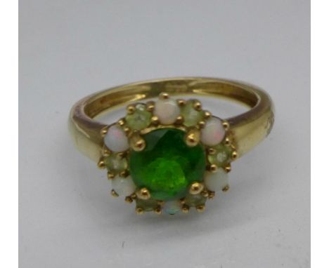 A 9ct gold, opal and green stone ring, 2.1g, K