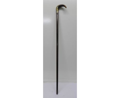 A silver banded, horn handled walking stick