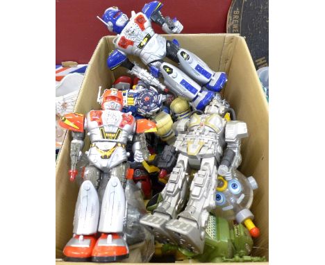 A large box of plastic robot toys