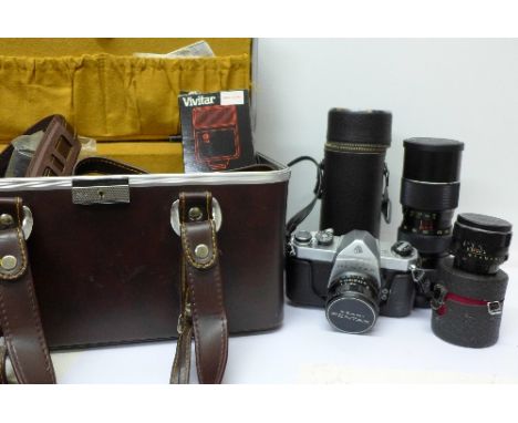 A Pentax Asahi 35mm film camera, flash gun, two spare lenses with a leather camera case