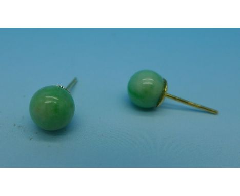 A pair of 18ct gold set jade stud earrings