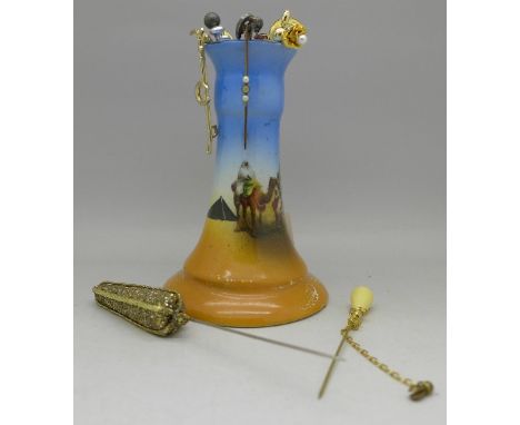 A hat pin stand, stick pins including bulls eye agate and one Scottish, a/f, two brooches, etc.