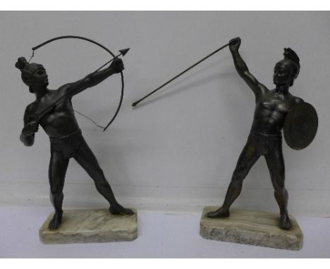 A pair of bronzed gladiators on marble bases, 29cm, arrow a/f