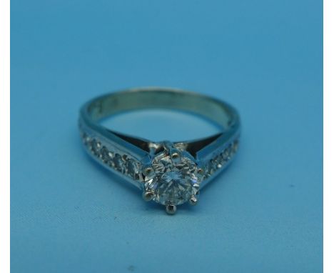 A platinum and diamond ring, main stone approximately 0.50ct diamond weight, 2.8g, K