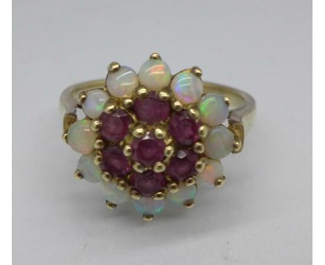 A 9ct gold, opal and ruby cluster ring, 3.7g, P