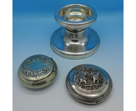 A wide silver candlestick or stand, a snuff box marked Alpaka and a white metal lid