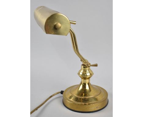 A Reproduction Brass Adjustable Desk Top Reading Light on Circular Plinth, 33cms High 