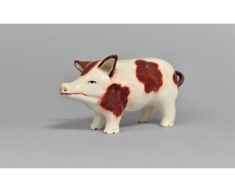 A Glazed Ceramic Novelty Money Box in the Form of a Pig, 13.5cms Long 