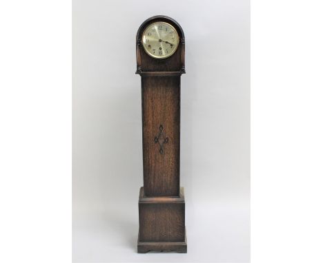 An Edwardian Oak Westminster Chime Grandmother Clock with Key and Pendulum, 129cms High 