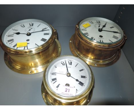 A selection of vintage wall mounted ship style clocks including Smith Astral