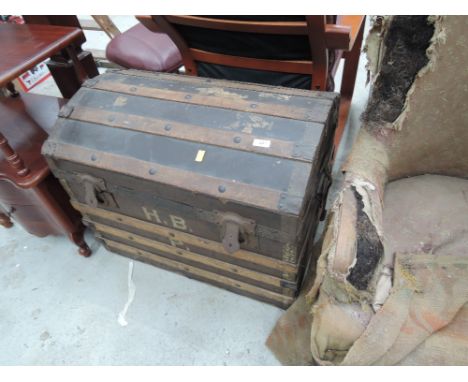 A vintage dome top cabin trunk