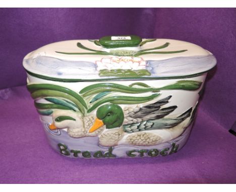 A vintage ceramic bread bin