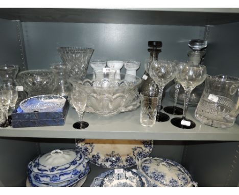 A selection of vintage clear cut and crystal glass wares including twist stem wine glasses