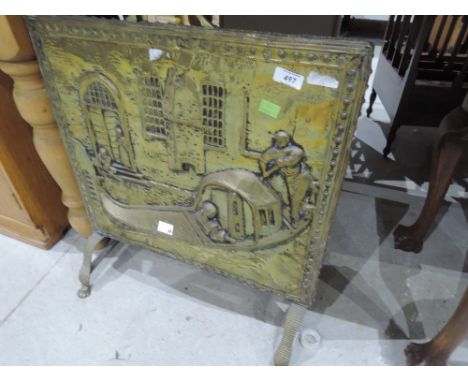 A brass fire screen having Venetian gondola decoration