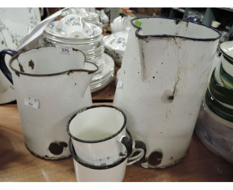 A selection of vintage tin and enamel kitchen wares