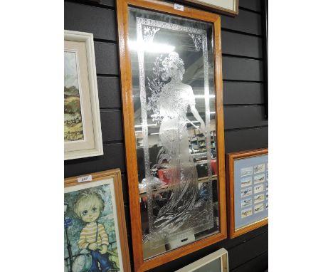 A vintage etched mirror with female figure of spring