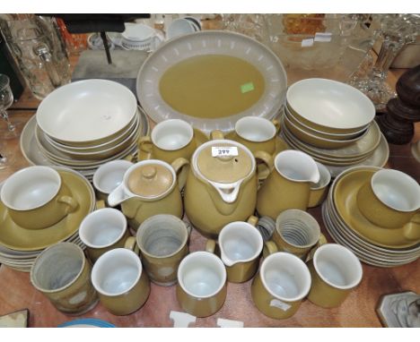 A vintage part dinner service by Denby in a yellow and white 