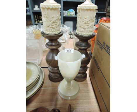 A selection of vintage candle sticks including wood turned