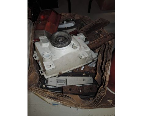 A selection of vintage car lights and spares