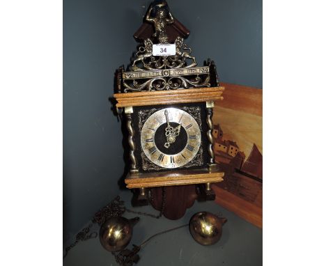 A vintage wall mounted clock treen and brass with Atlas figure holding globe 