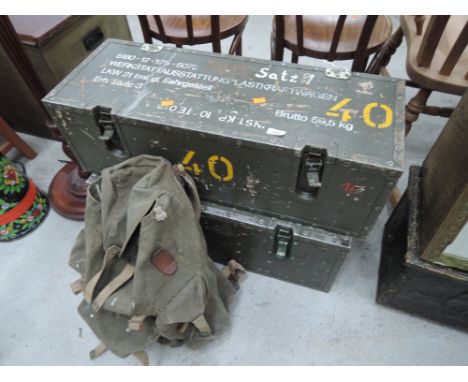 Two vintage German military ammunition boxes and a rucksack
