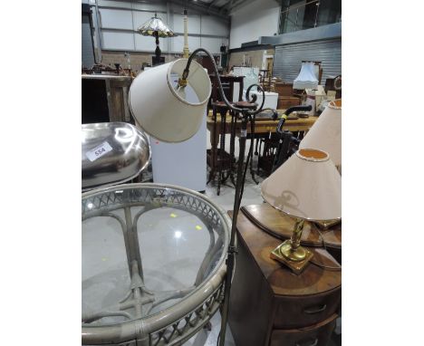 A reproduction Victorian style reading lamp