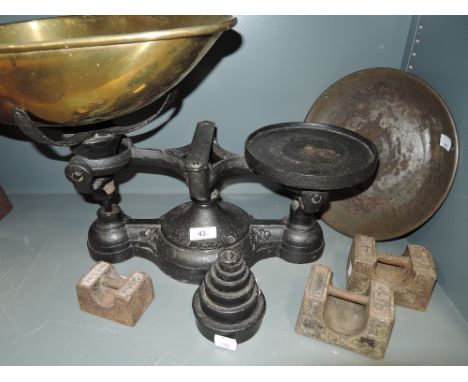 A large cast scale and balance set with graduated weights