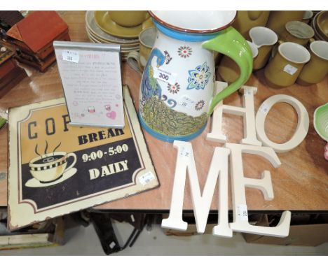 A selection of vintage home decorations and modern signs