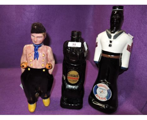 A selection of vintage figural advertising spirit decanters including Barbados Rum and Cossack Vodka