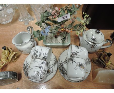 A selection of vintage oriental style decorations and coffee cups