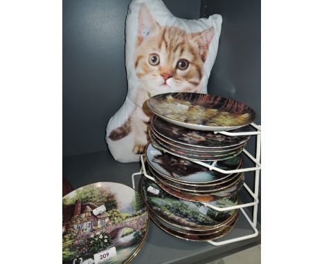 A selection of vintage cabinet display plates including kittens and cats