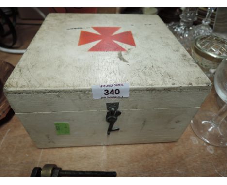 A vintage wooden first aid kit box