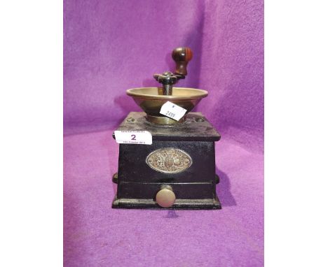 A vintage Kenrick coffee mill grinder for the kitchen cast with brass