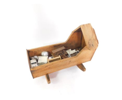A vintage pine model of a crib, 45.5cm long, together with dolls house furniture, and metalware.