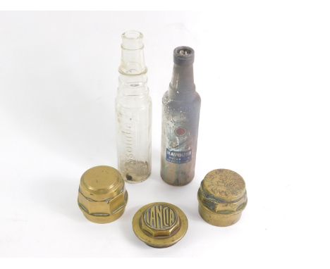 Three brass hub caps, including Lancia and one engraved to J & R Chapman, Builders, Kings Cliffe, together with an Essolube m