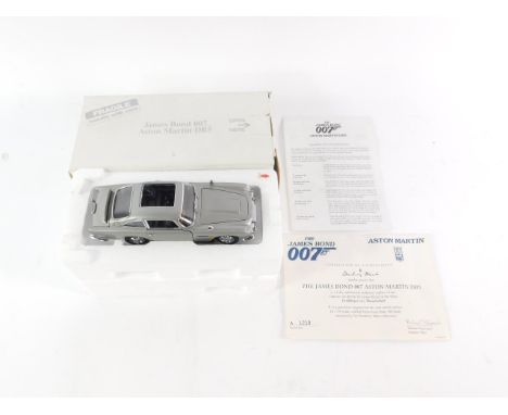 A Danbury Mint die cast replica of the James Bond 007 Aston Martin DB5, as driven by James Bond in the films Goldfinger and T