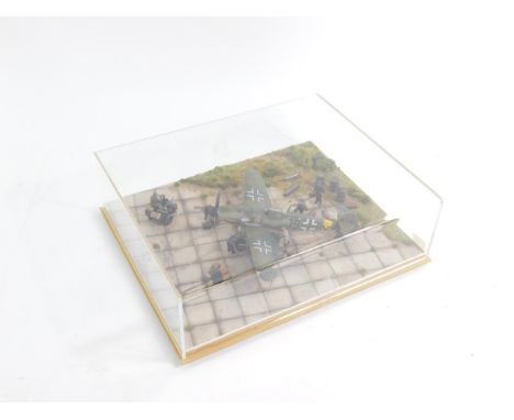 A professional made model diorama of a German ME109G WWII fighter aircraft, scale 1:48, perspex cased.