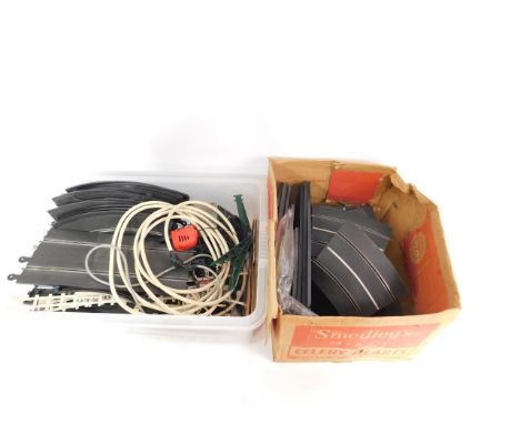 Scalextric, comprising track, barriers, fences and a power controller.