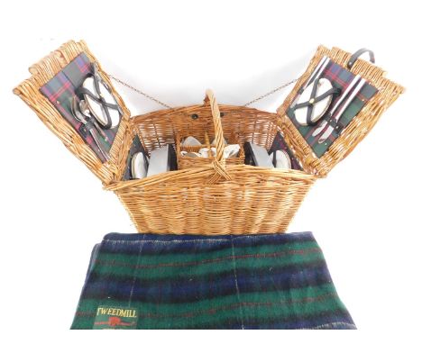 A Bentley wicker picnic hamper and contents, made by W Gadsby & Son, four place settings, with ground rug.