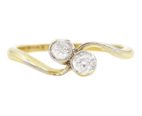 Early 20th century 18ct gold two stone old cut diamond ring, stamped, total diamond weight approx 0.25 carat Condition Report