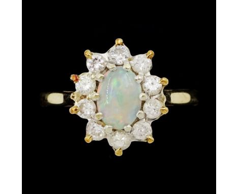 9ct gold oval opal and round brilliant cut diamond cluster ring, London 1982, total diamond weight approx 0.30 caratCondition